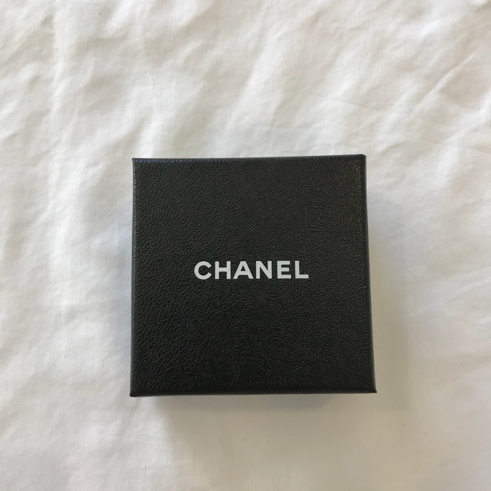 Womens gold Chanel stud earrings